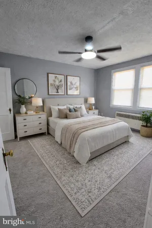a bedroom with bed and window