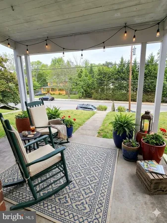 a view of swimming pool with outdoor seating