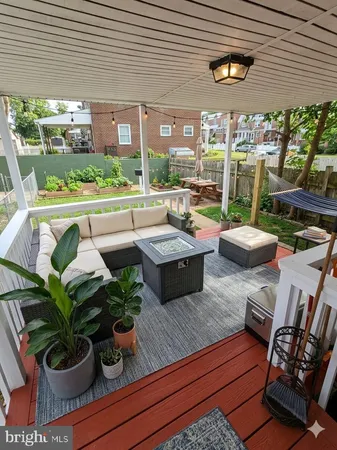 a outdoor living space with furniture and a potted plant