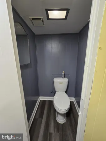 a bathroom with a toilet and a sink