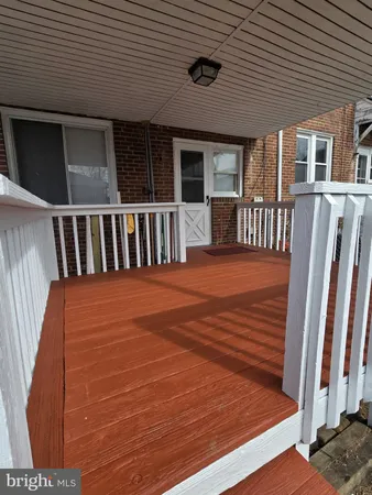 a balcony view with a seating space