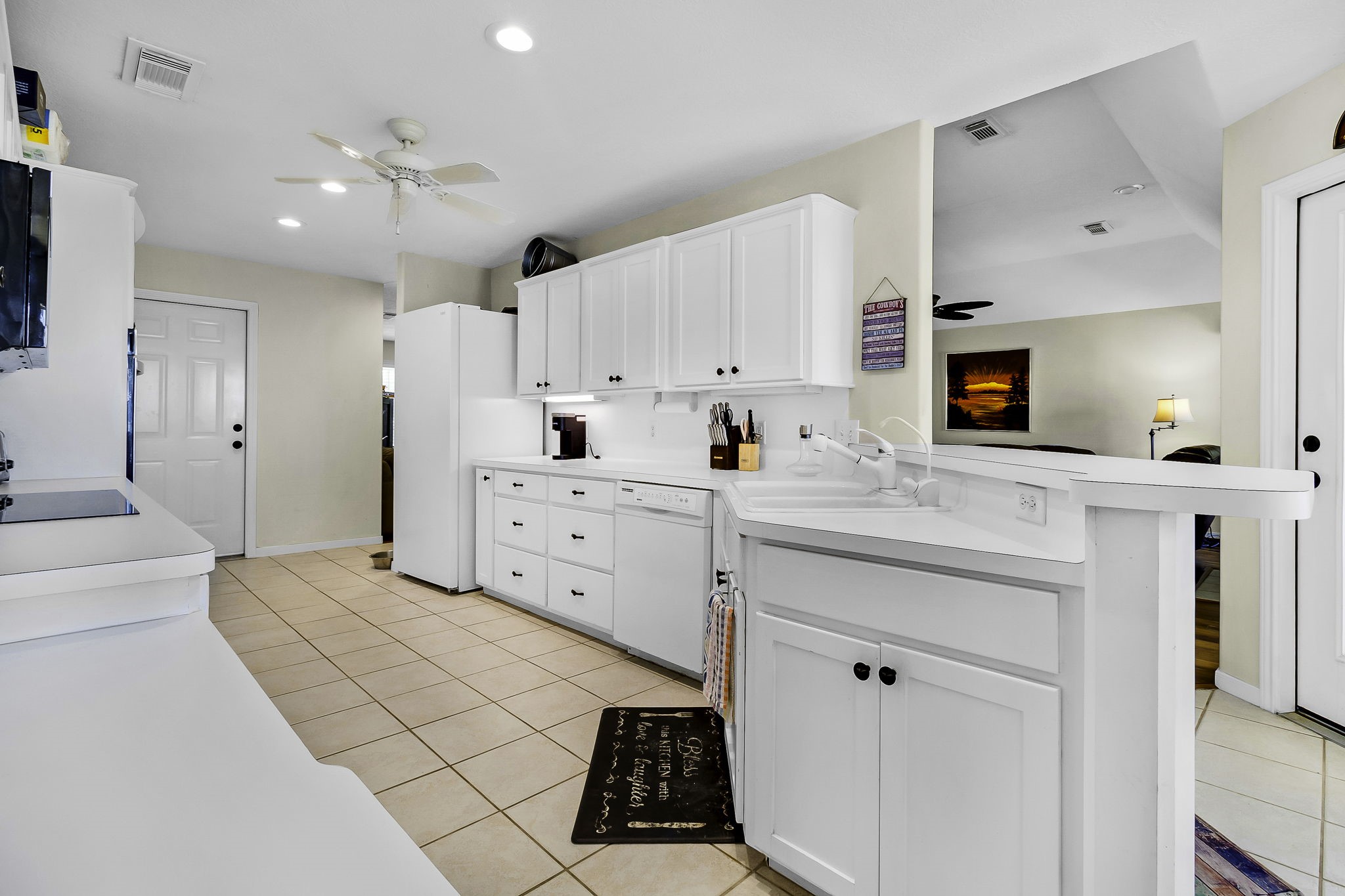 1346 Landing Way Trinity, TX 75862 - Photo 11 of 45 a large white kitchen with a sink and cabinets
