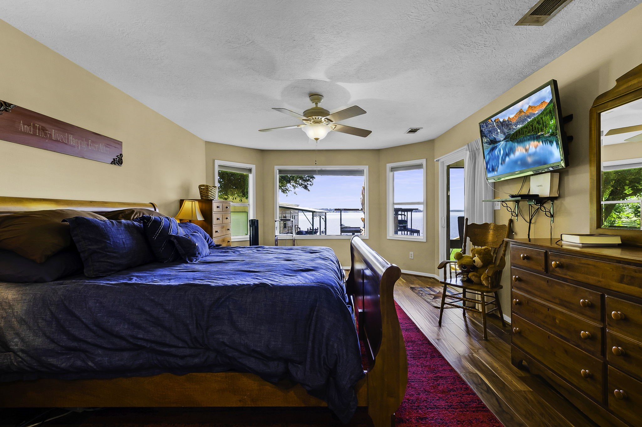 1346 Landing Way Trinity, TX 75862 - Photo 14 of 45 a bed room with a bed and a chandelier