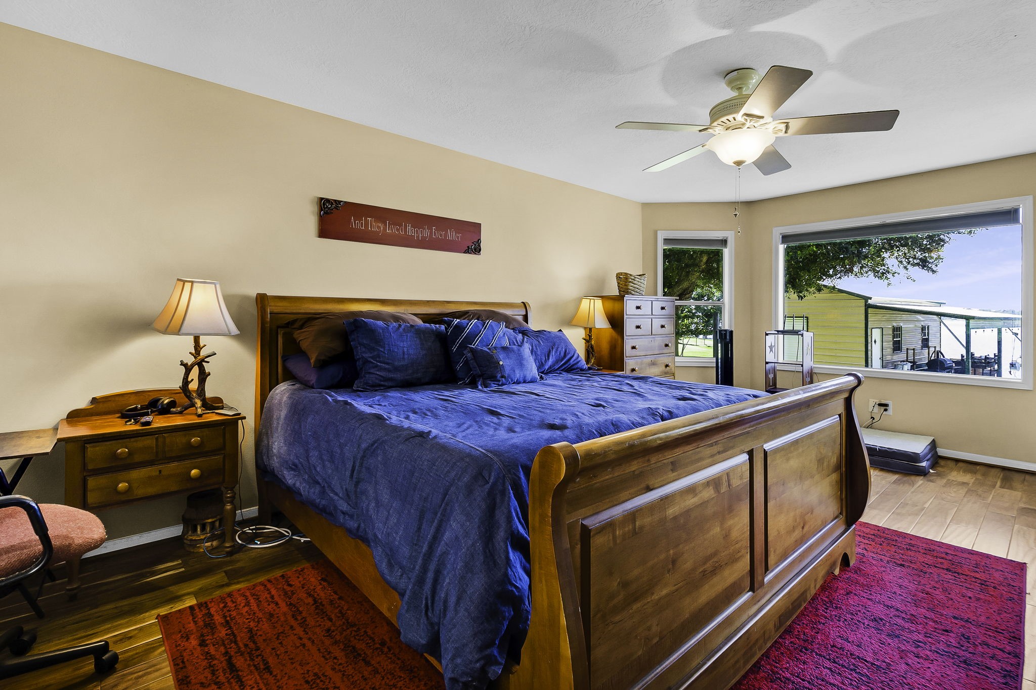 1346 Landing Way Trinity, TX 75862 - Photo 15 of 45 a bed room with a bed and a chandelier