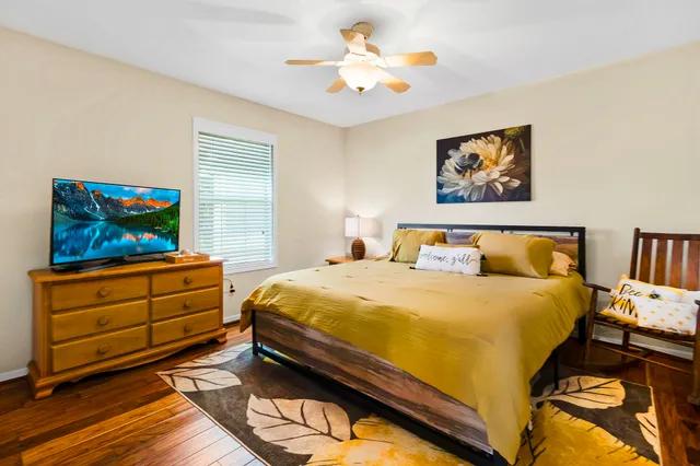 a bed room with a bed and a television