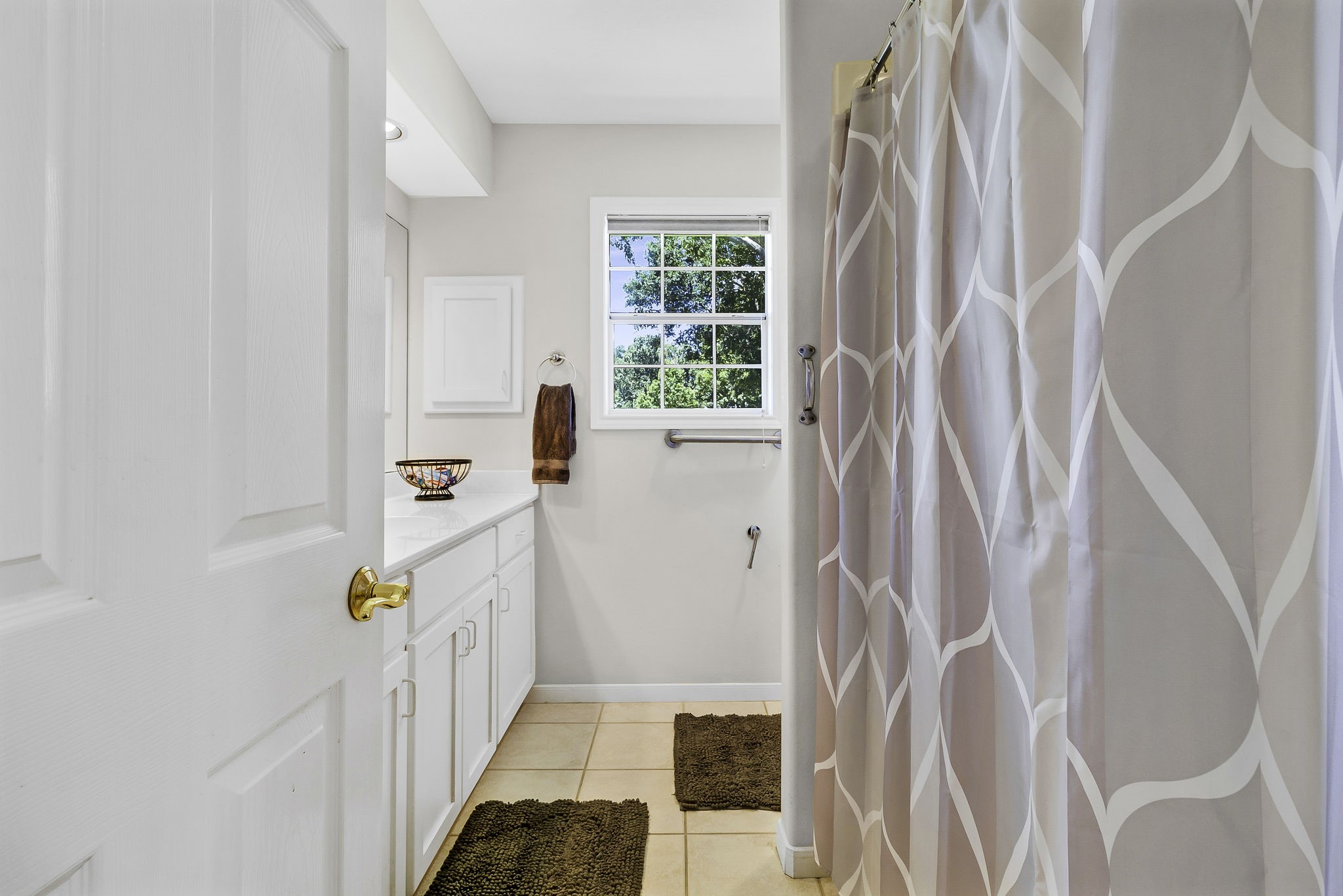 1346 Landing Way Trinity, TX 75862 - Photo 20 of 45 a bathroom with a sink a toilet a window and shower