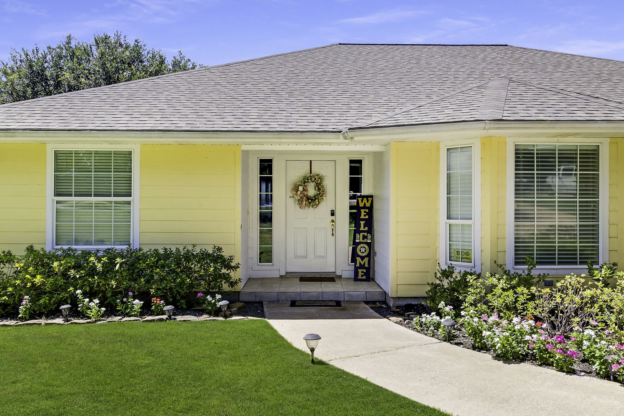 1346 Landing Way Trinity, TX 75862 - Photo 2 of 45 a front view of a house with a garden