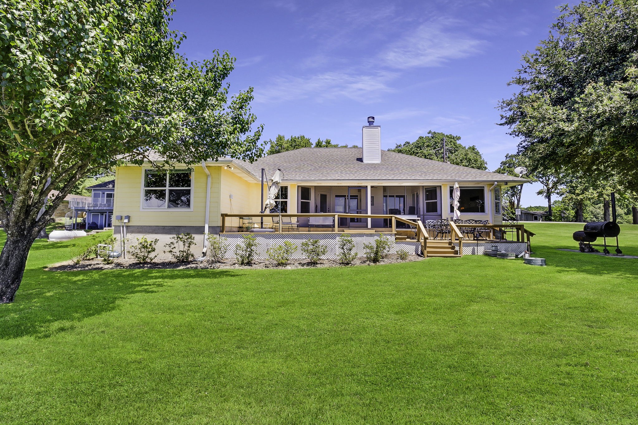 1346 Landing Way Trinity, TX 75862 - Photo 25 of 45 a front view of a house with a yard table and chairs