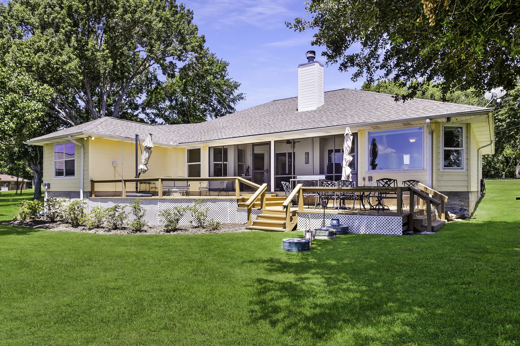 1346 Landing Way Trinity, TX 75862 - Photo 3 of 45 a view of a house with a yard deck and sitting area