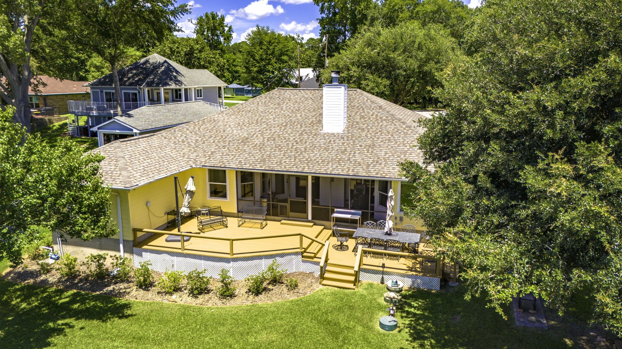 1346 Landing Way Trinity, TX 75862 - Photo 38 of 45 a view of house with swimming pool outdoor seating and trees