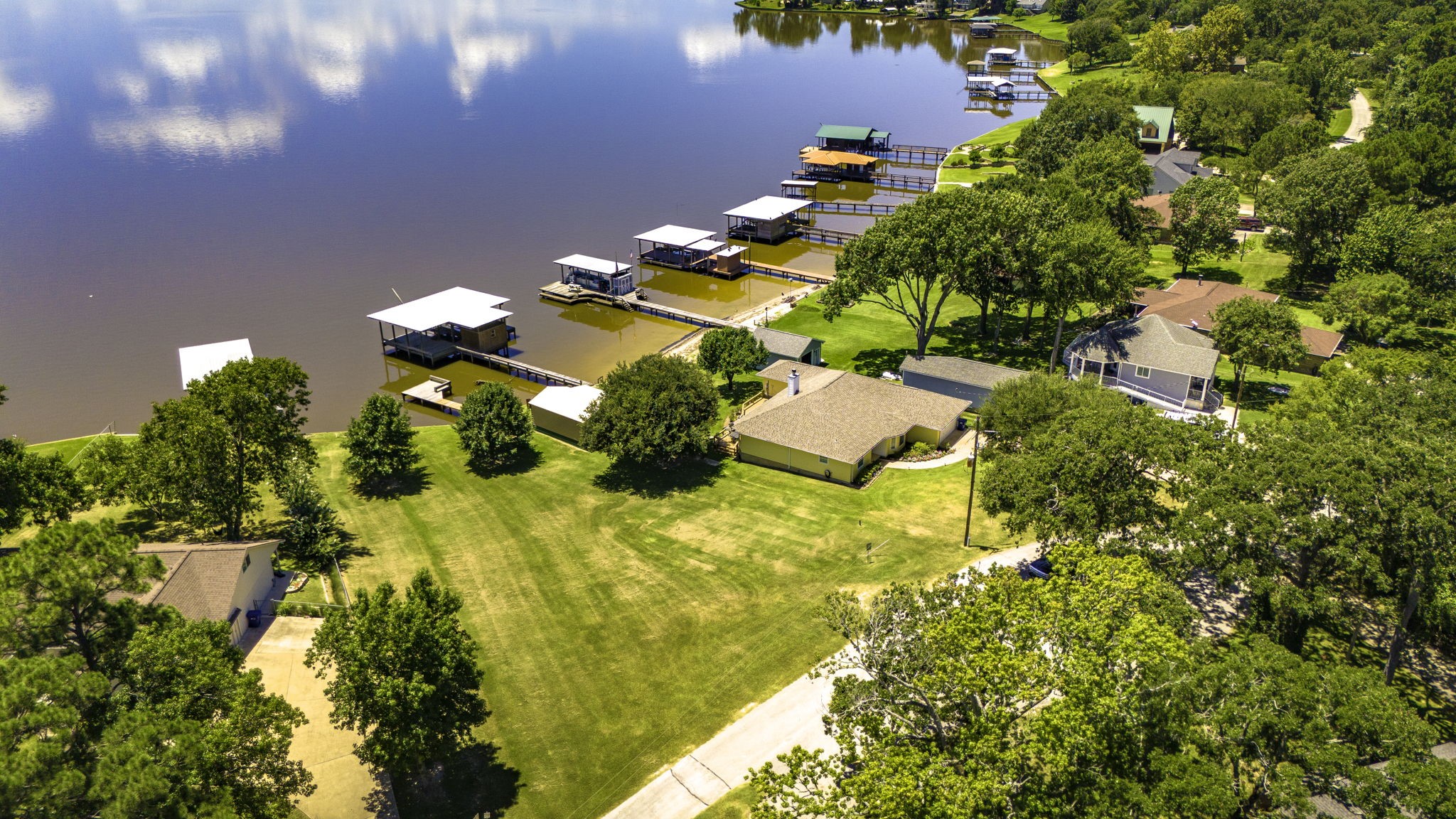 1346 Landing Way Trinity, TX 75862 - Photo 41 of 45 an aerial view of residential house with swimming pool and lawn chairs