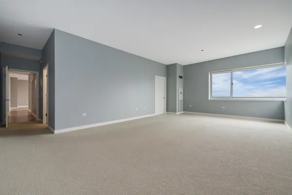 a view of an empty room with a window