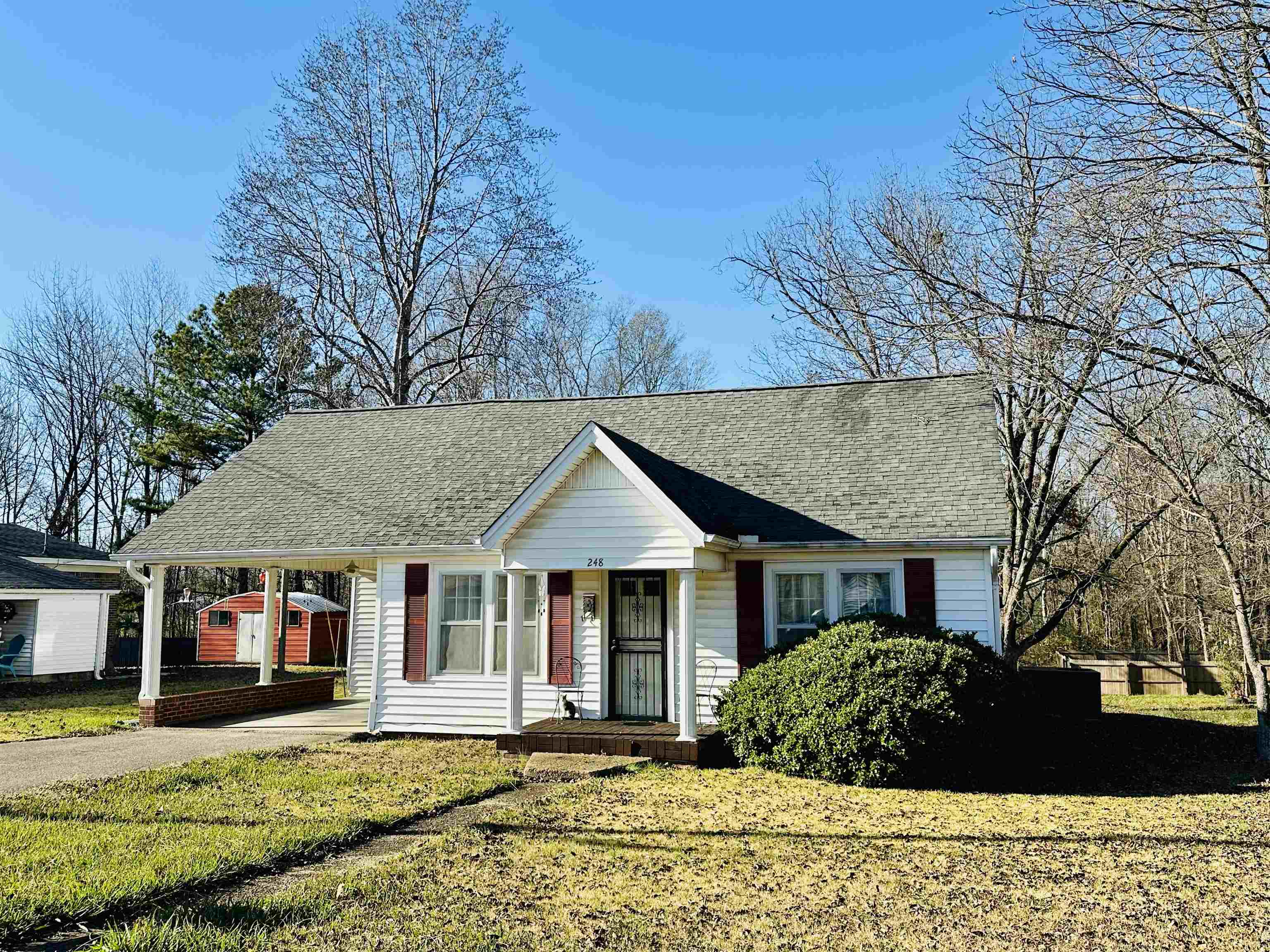 248 Canal Street Selmer, TN 38375 - Photo 1 of 21 a front view of a house with a yard
