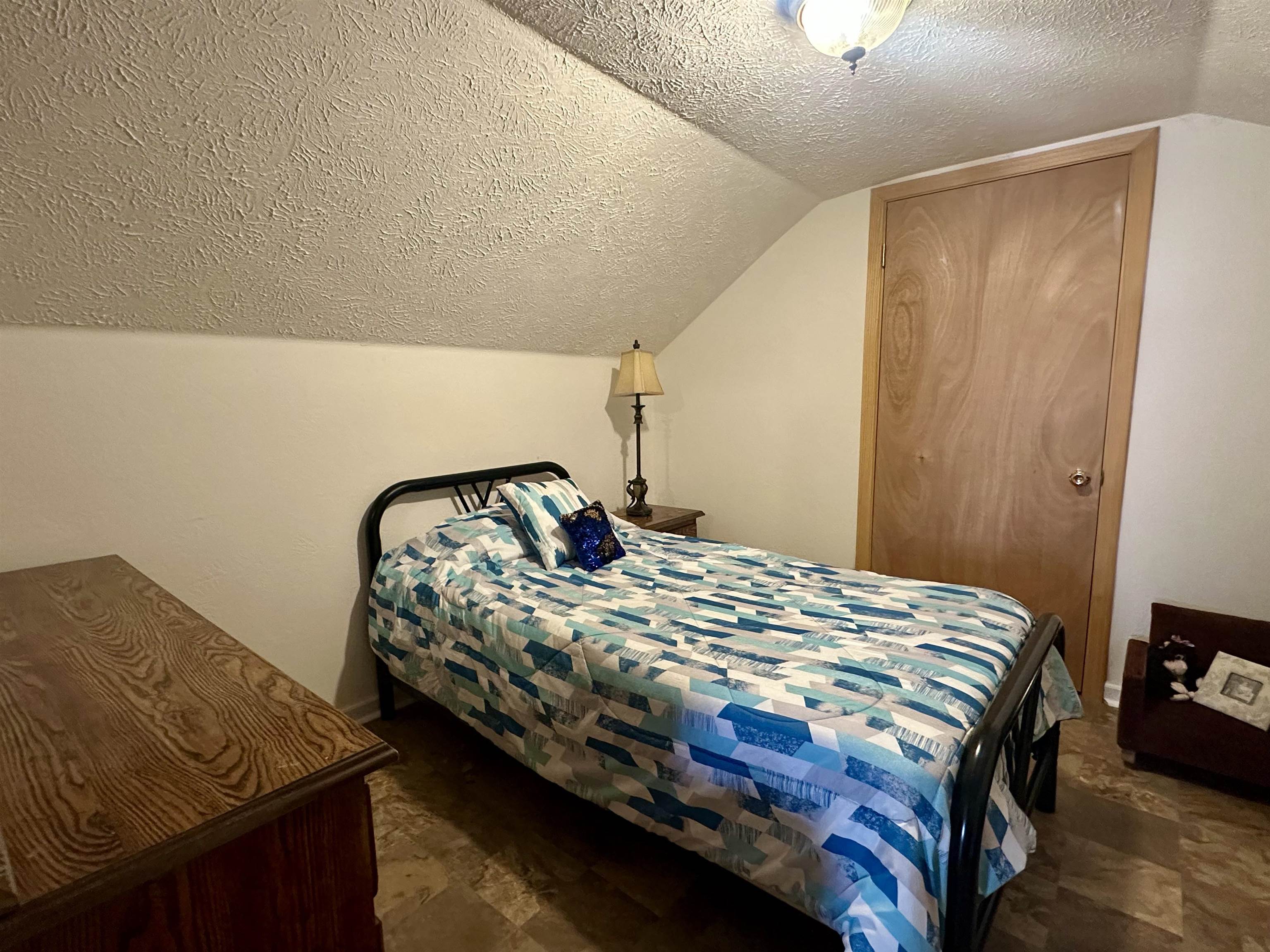 248 Canal Street Selmer, TN 38375 - Photo 13 of 21 a bedroom with a bed and a mirror