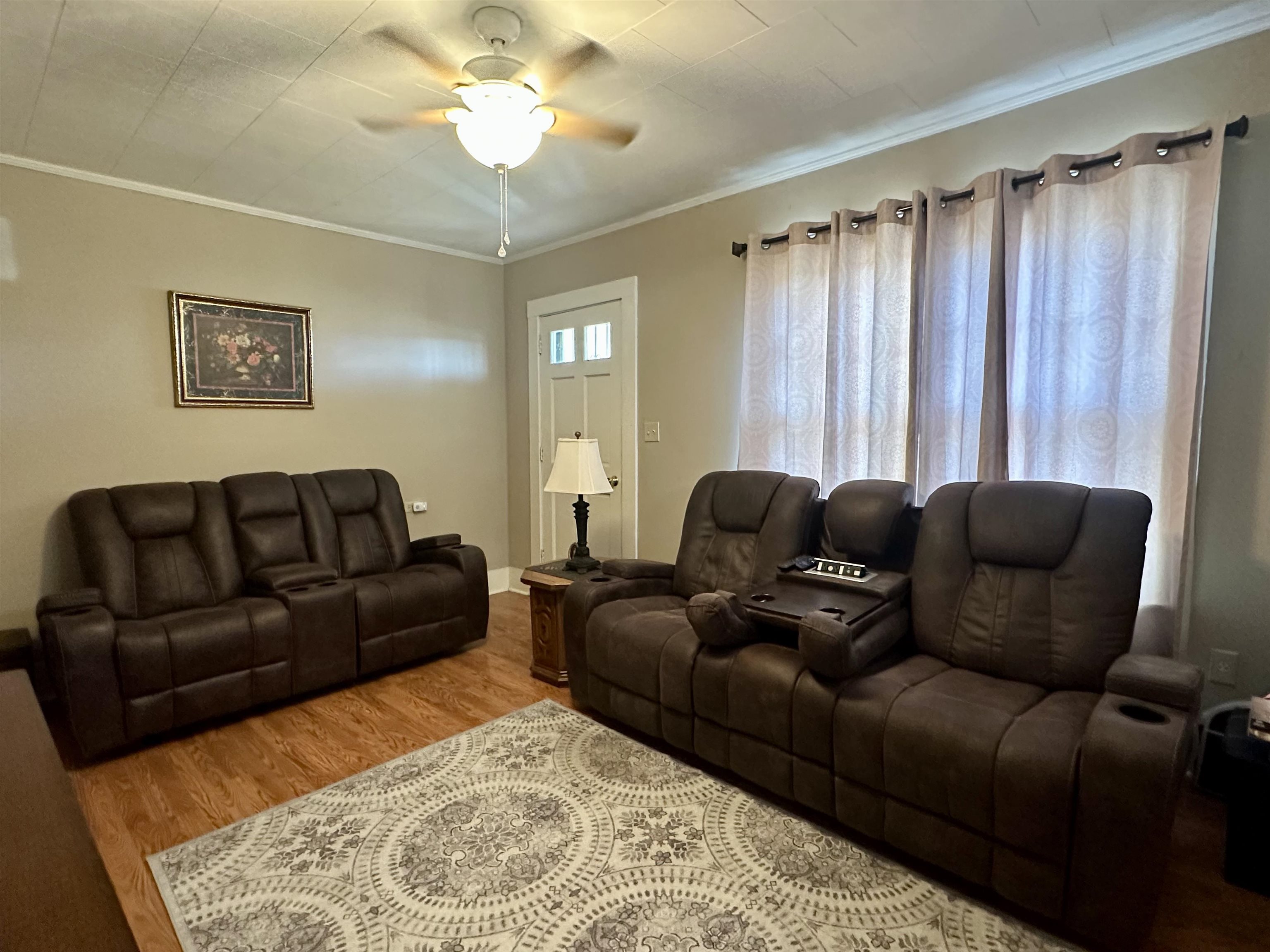 248 Canal Street Selmer, TN 38375 - Photo 2 of 21 a living room with a couch and a chandelier