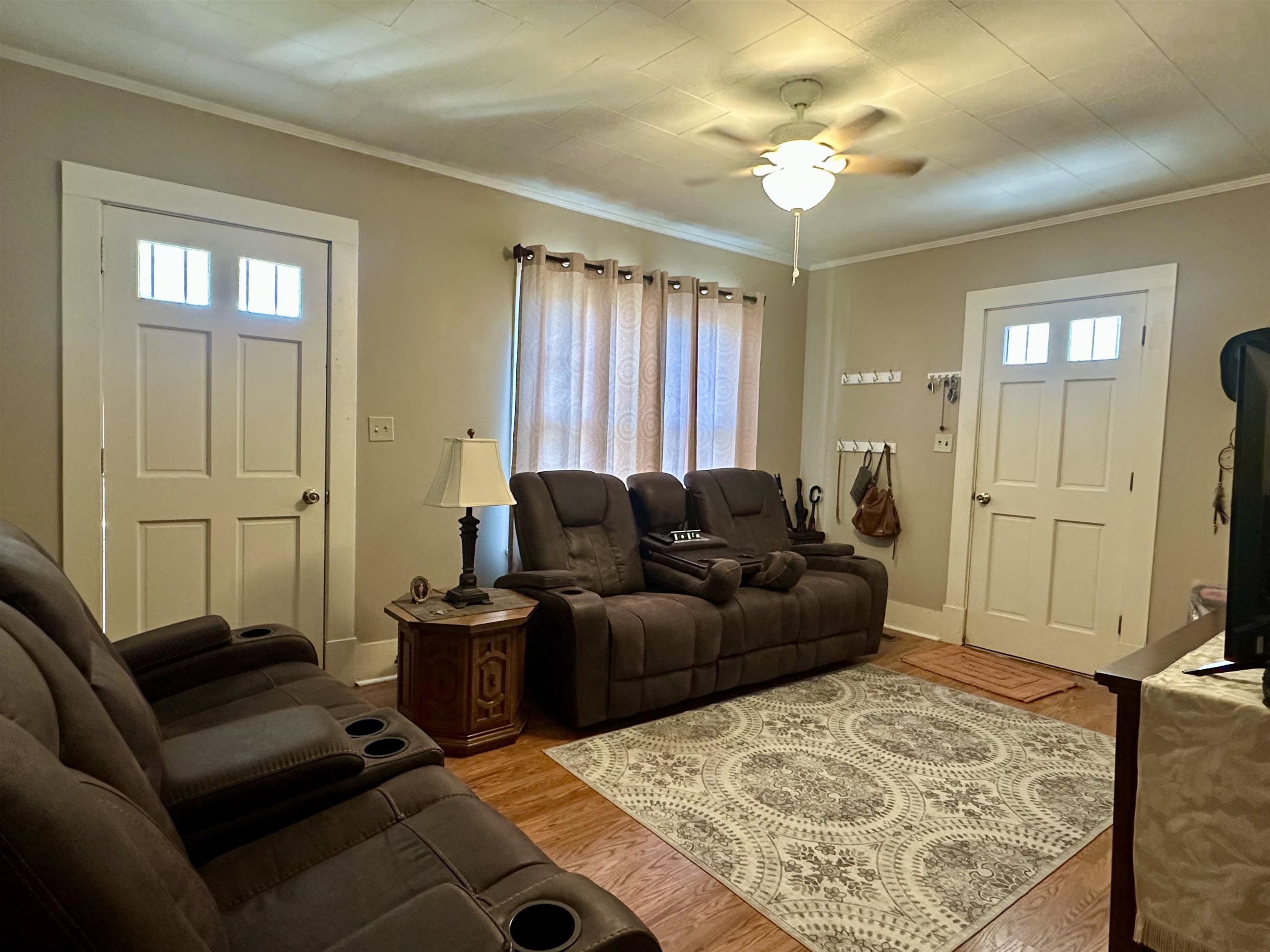 248 Canal Street Selmer, TN 38375 - Photo 3 of 21 a living room with furniture and a flat screen tv
