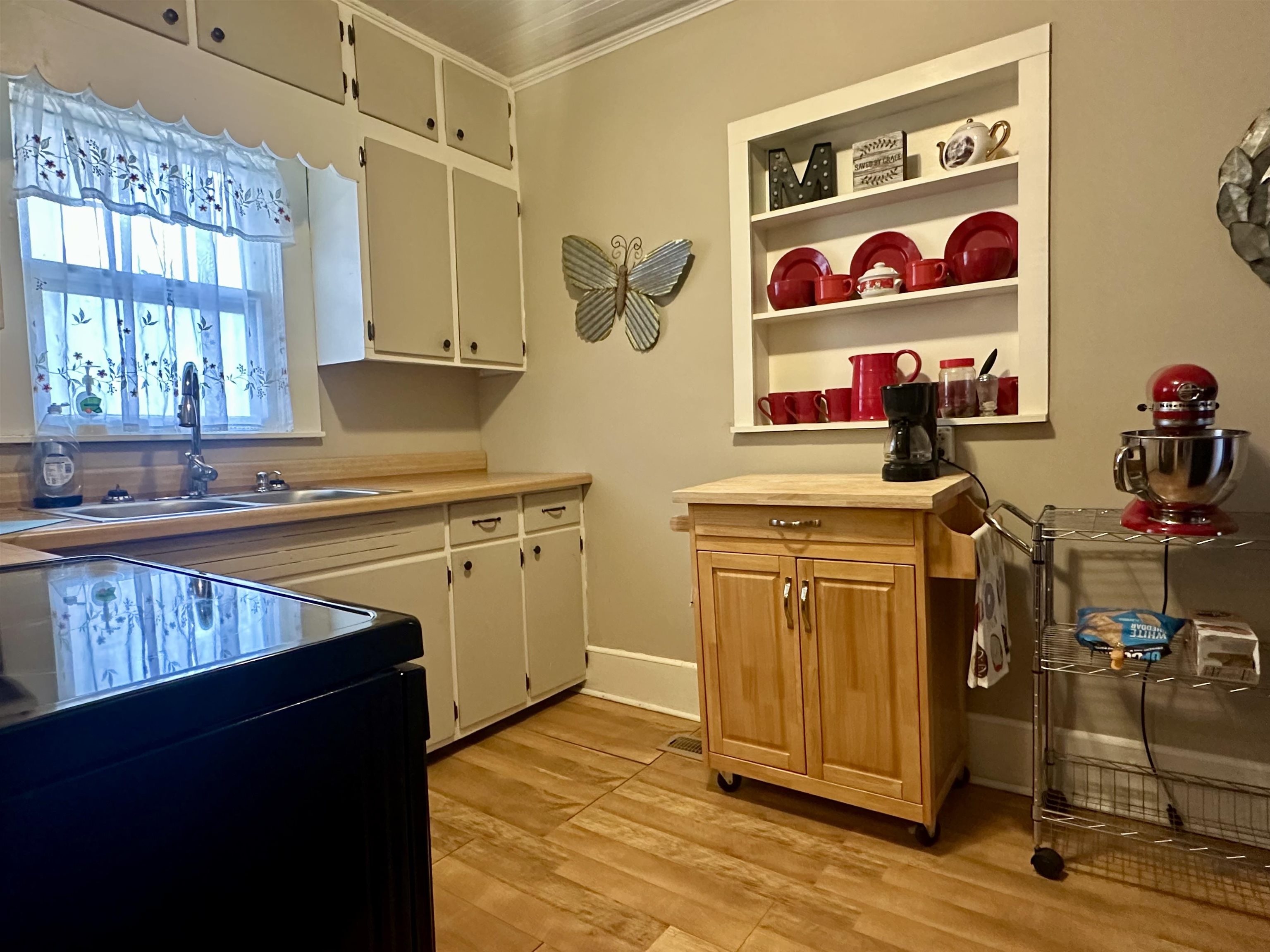 248 Canal Street Selmer, TN 38375 - Photo 5 of 21 a kitchen with stainless steel appliances granite countertop a stove and a sink