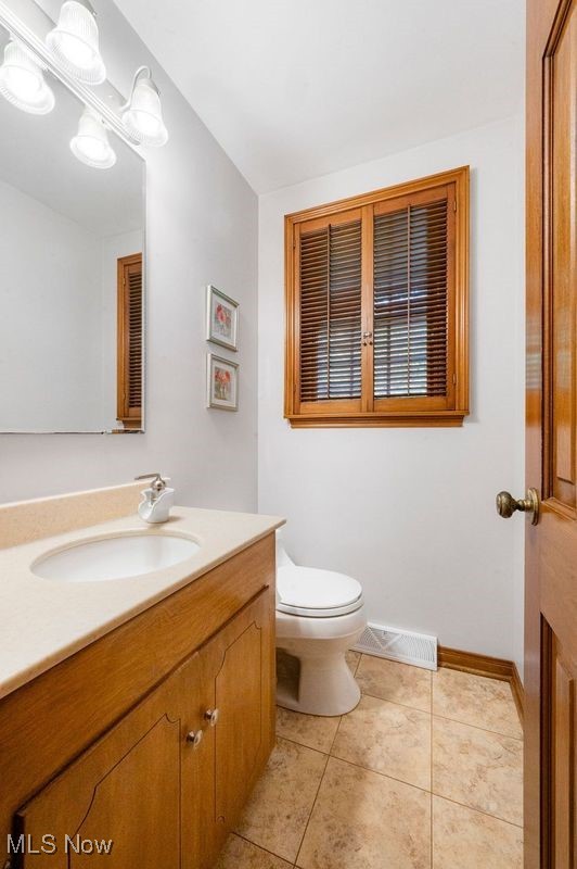 3022 Midvale Road Northwest Canton, OH 44718 - Photo 16 of 33 Bathroom with vanity, tile patterned flooring, and toilet