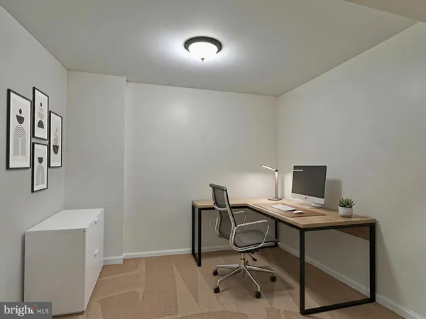 a view of a workspace with furniture