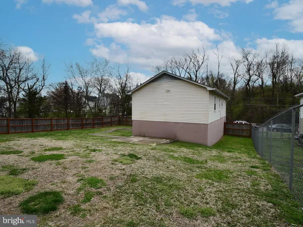 a view of backyard with green space