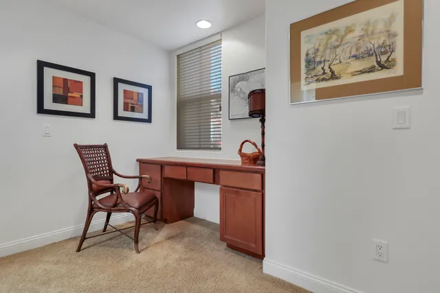 a view of a workspace with furniture