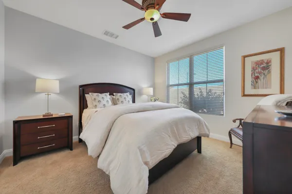 a bedroom with a bed and window
