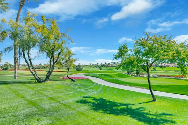 a view of a park with swings and slides