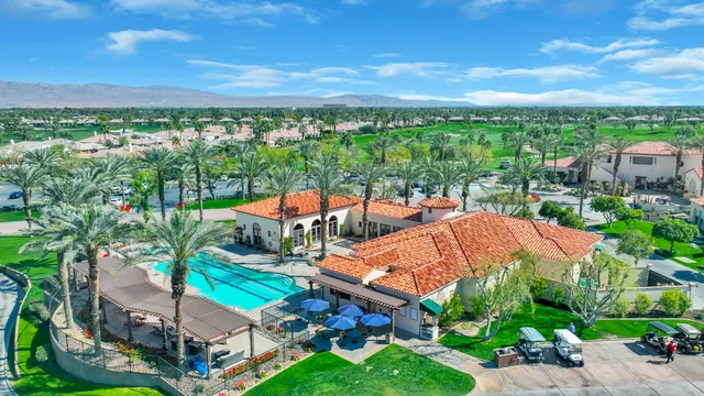 a view of yard with swimming pool and green space