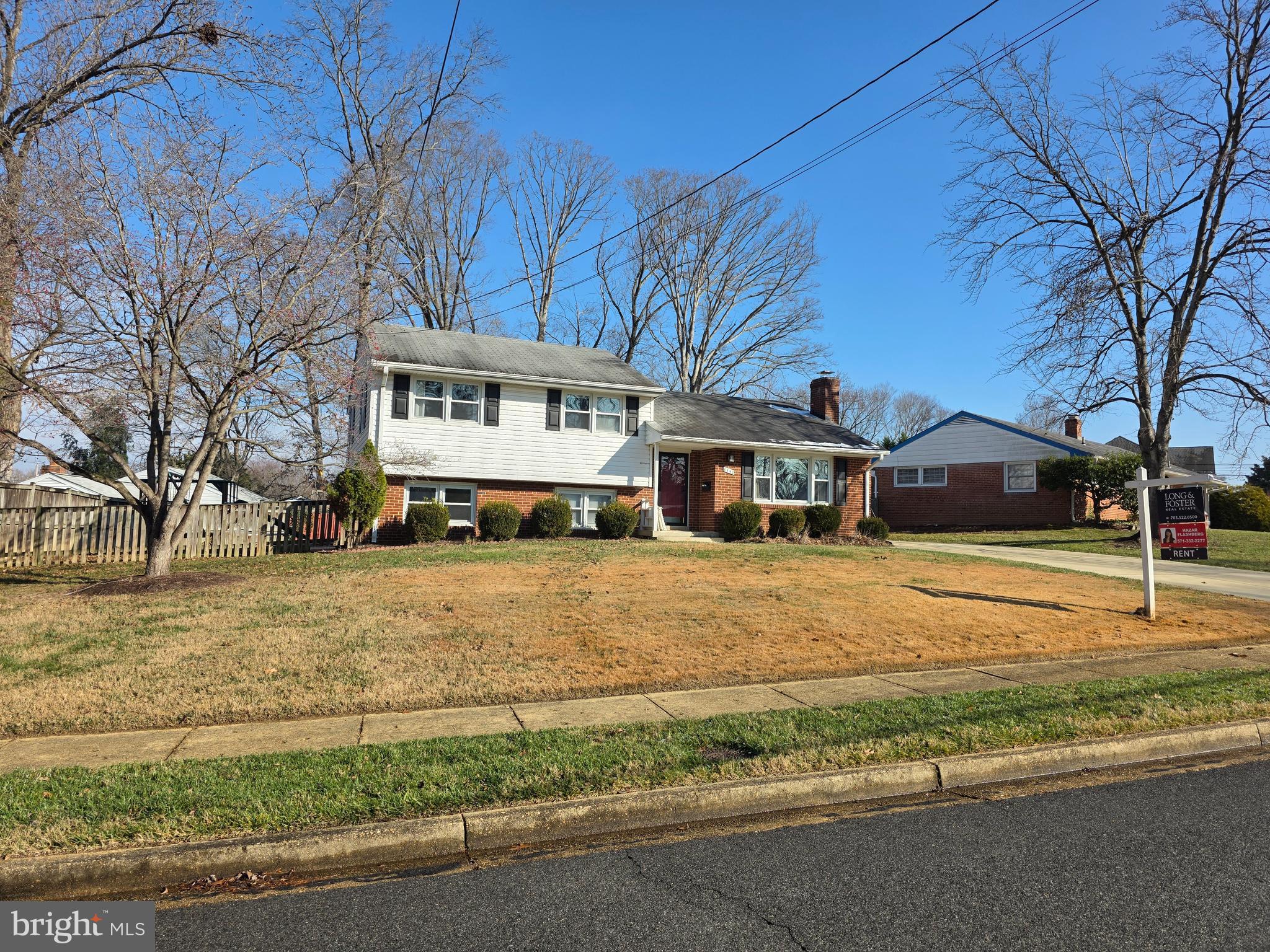 8140 Drayton Lane Springfield, VA 22151 - Photo 1 of 98 a front view of a house with a yard