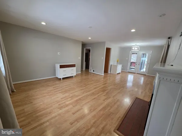 a kitchen with stainless steel appliances kitchen island granite countertop a refrigerator and a sink