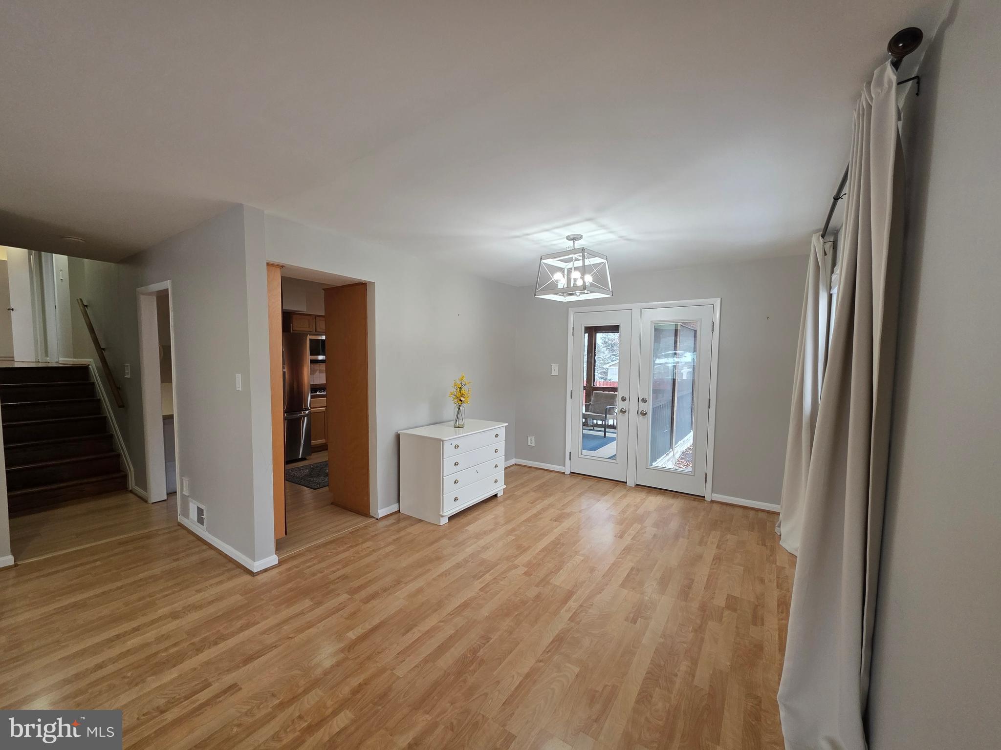 8140 Drayton Lane Springfield, VA 22151 - Photo 20 of 98 a view of a kitchen with wooden floor and a refrigerator