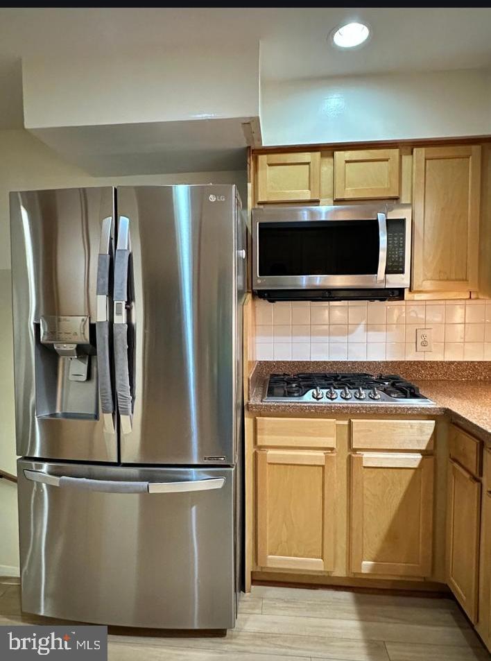 8140 Drayton Lane Springfield, VA 22151 - Photo 25 of 98 a kitchen with stainless steel appliances granite countertop a refrigerator and a stove top oven
