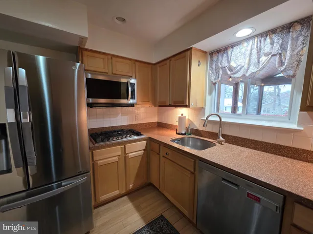 a bathroom with a toilet a sink and shower