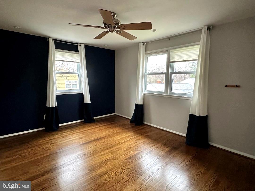 8140 Drayton Lane Springfield, VA 22151 - Photo 39 of 98 a view of an empty room with wooden floor and a window