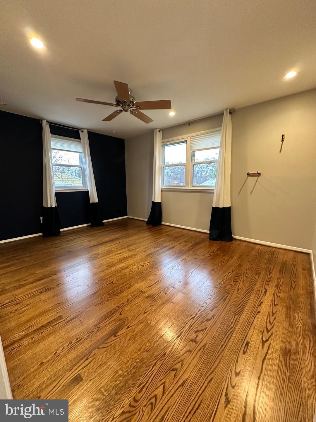 8140 Drayton Lane Springfield, VA 22151 - Photo 40 of 98 an empty room with wooden floor and windows