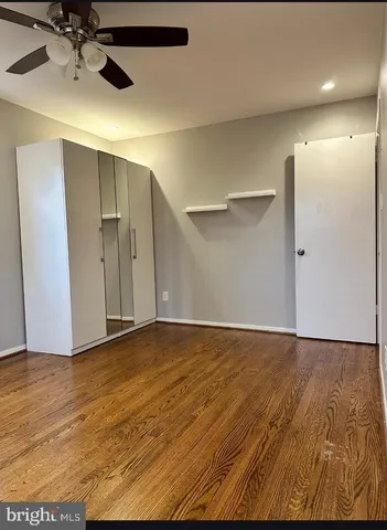 a view of backyard with swimming pool and seating space