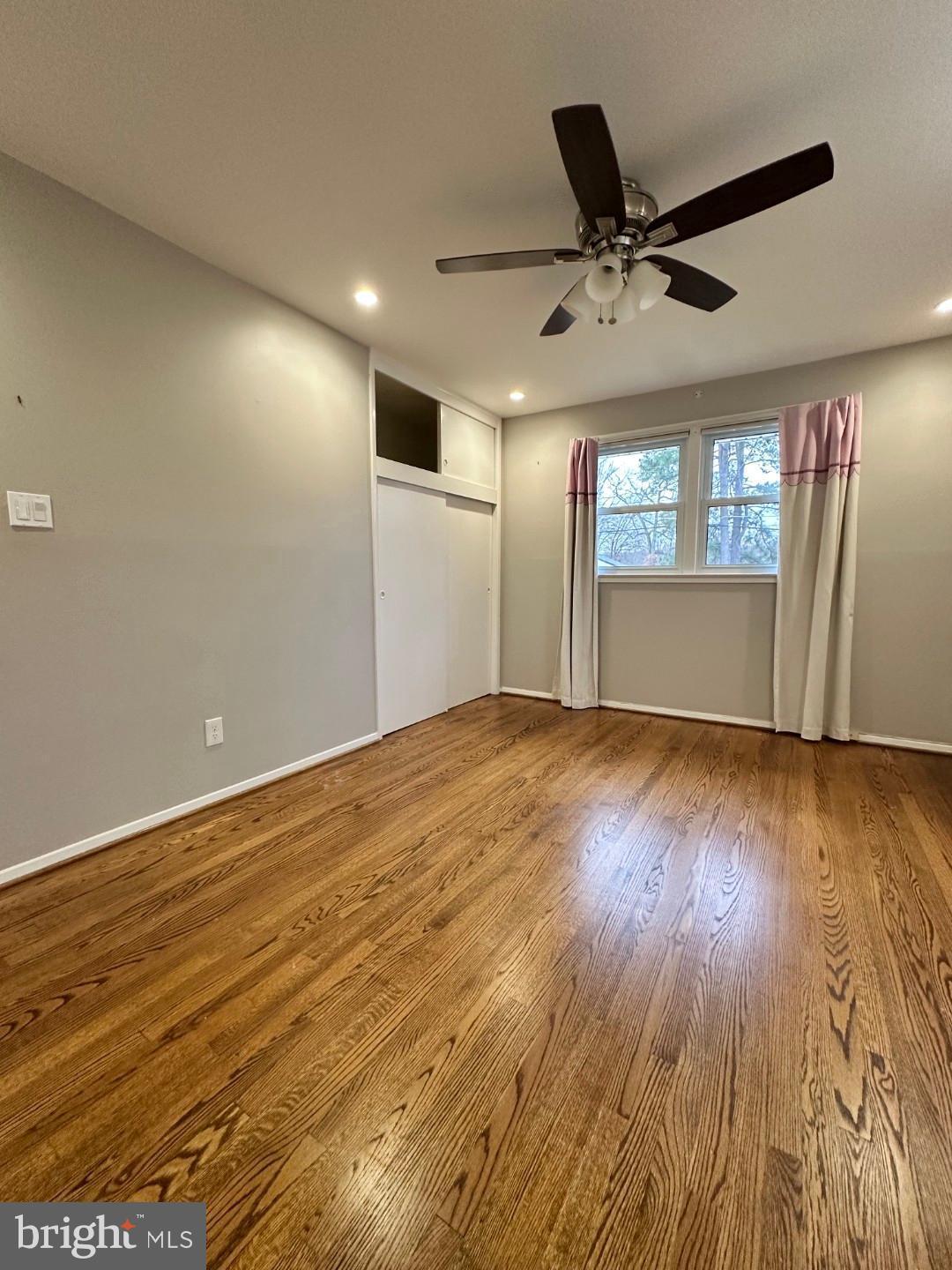 8140 Drayton Lane Springfield, VA 22151 - Photo 50 of 98 a view of empty room with wooden floor and fan