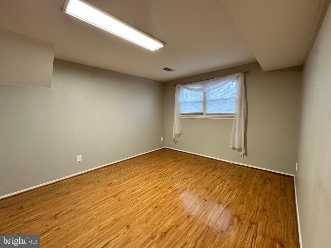 8140 Drayton Lane Springfield, VA 22151 - Photo 78 of 98 wooden floor in an empty room