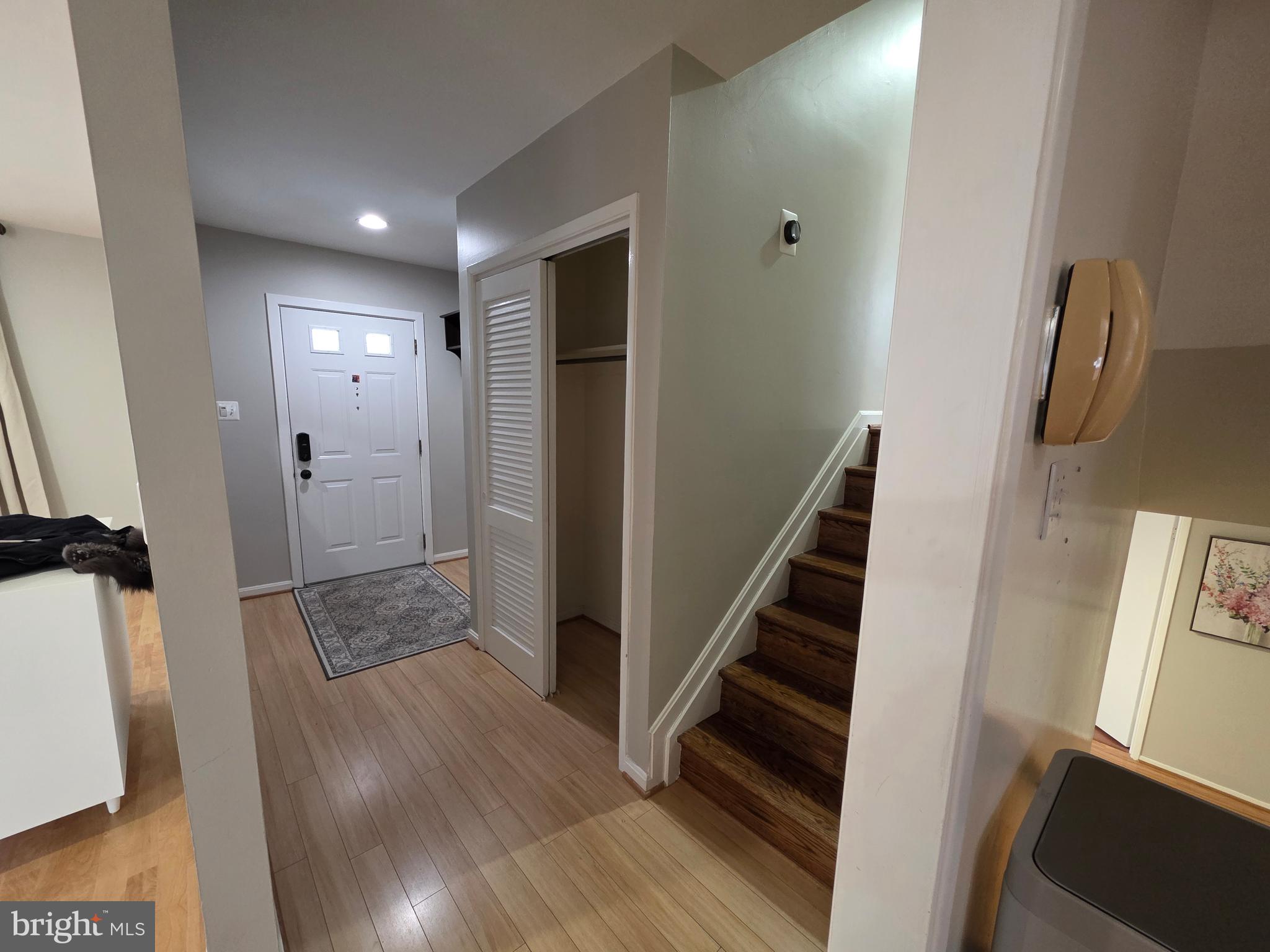 8140 Drayton Lane Springfield, VA 22151 - Photo 8 of 98 a view of a hallway with wooden floor and staircase