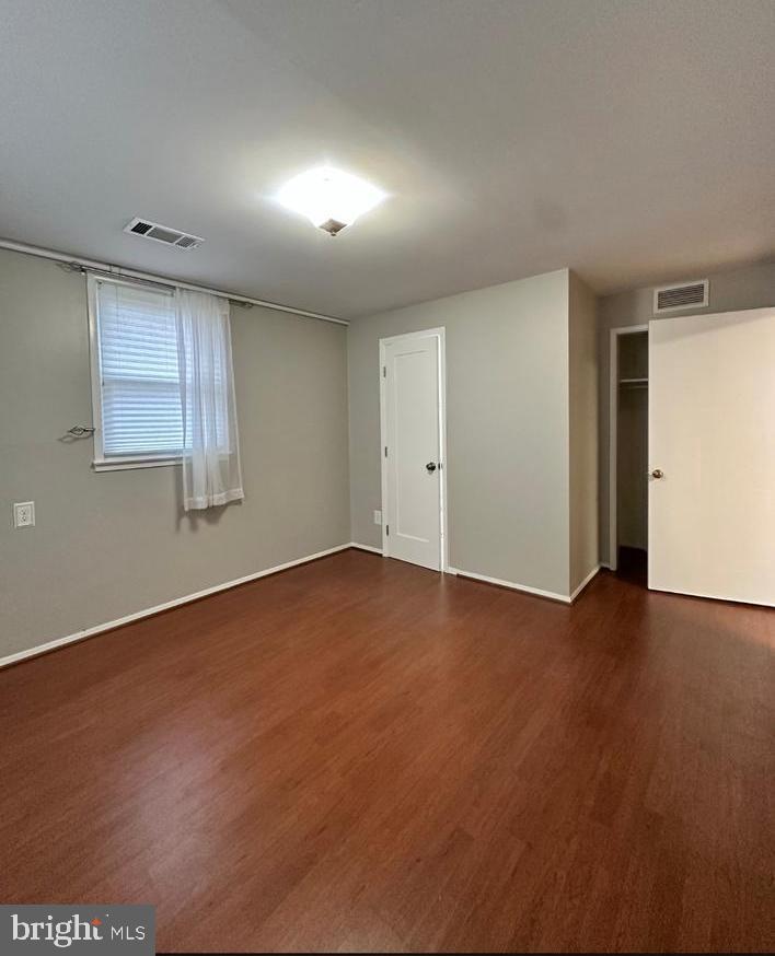 8140 Drayton Lane Springfield, VA 22151 - Photo 83 of 98 an empty room with wooden floor and windows