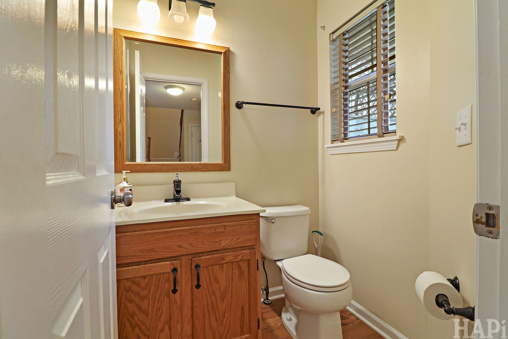 1728 Leeds Court, Unit 1728 Mundelein, IL 60060 - Photo 11 of 23 a bathroom with a toilet sink and mirror