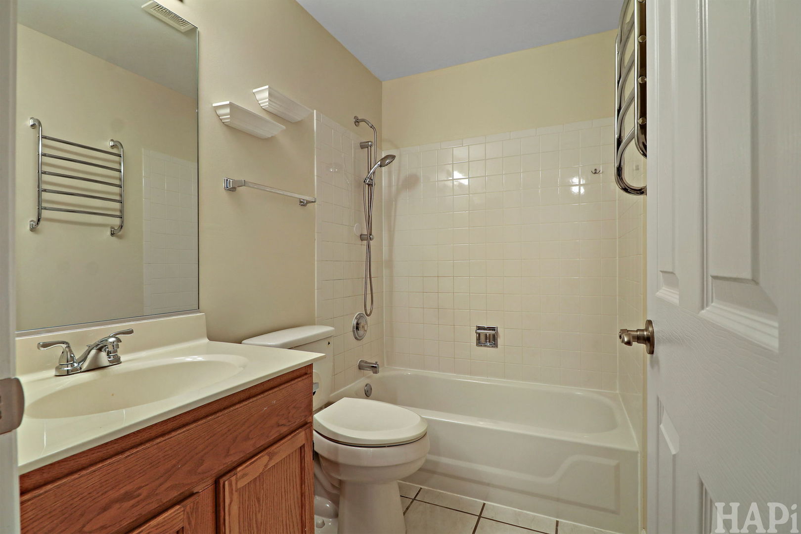 1728 Leeds Court, Unit 1728 Mundelein, IL 60060 - Photo 18 of 23 a bathroom with a granite countertop sink toilet and shower