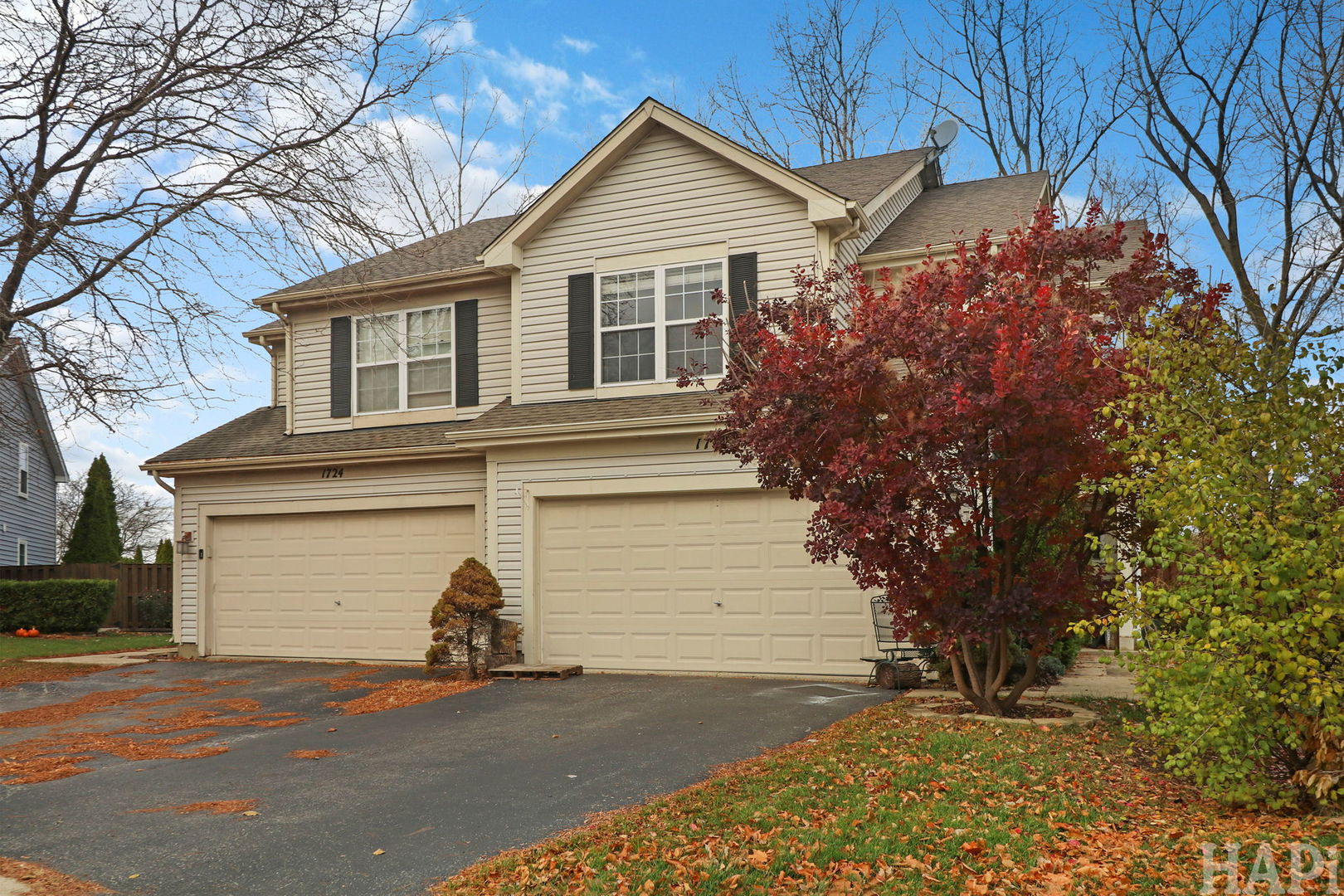 1728 Leeds Court, Unit 1728 Mundelein, IL 60060 - Photo 22 of 23 a view of a house with a yard and garage