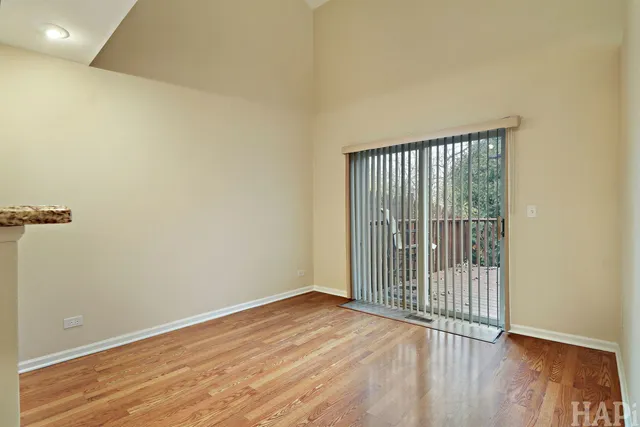 a view of a room with wooden floor