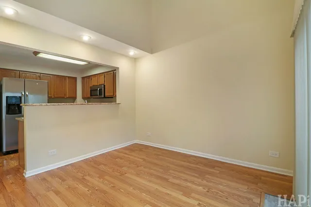 a view of a kitchen with wooden floor