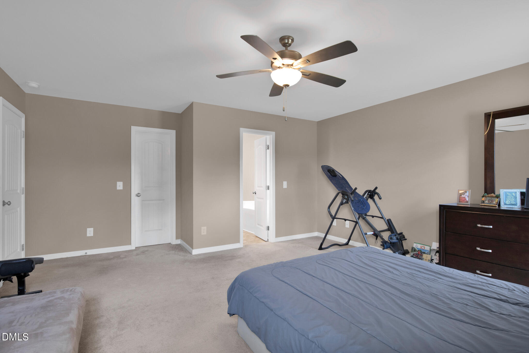 87 Hawks Croft Court Erwin, NC 28339 - Photo 17 of 30 a bedroom with a bed and a chandelier