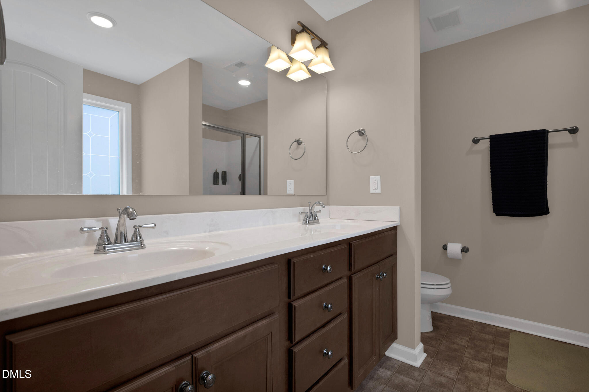 87 Hawks Croft Court Erwin, NC 28339 - Photo 18 of 30 a bathroom with a double vanity sink and a mirror