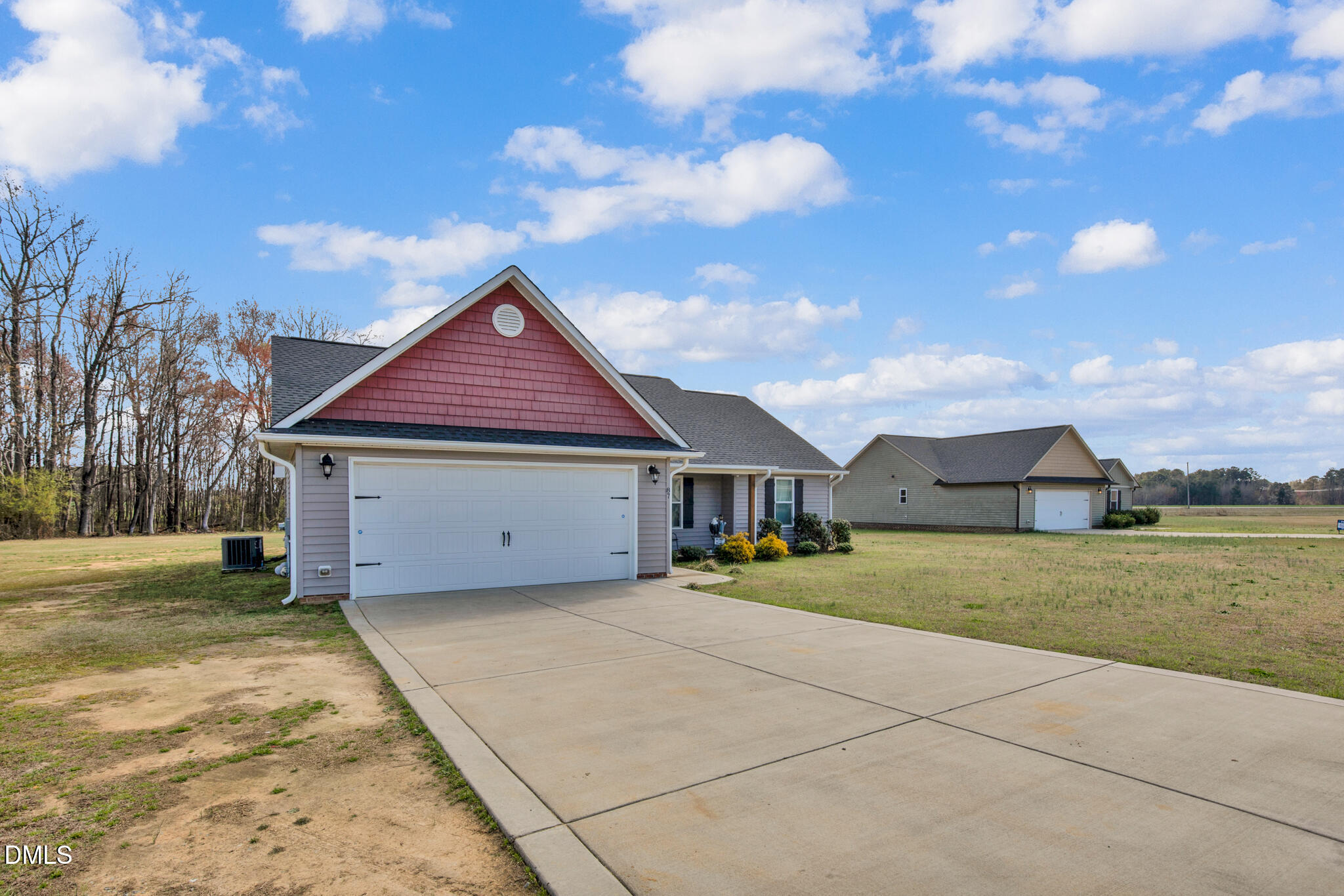 87 Hawks Croft Court Erwin, NC 28339 - Photo 2 of 30 a front view of a house with a yard and garage