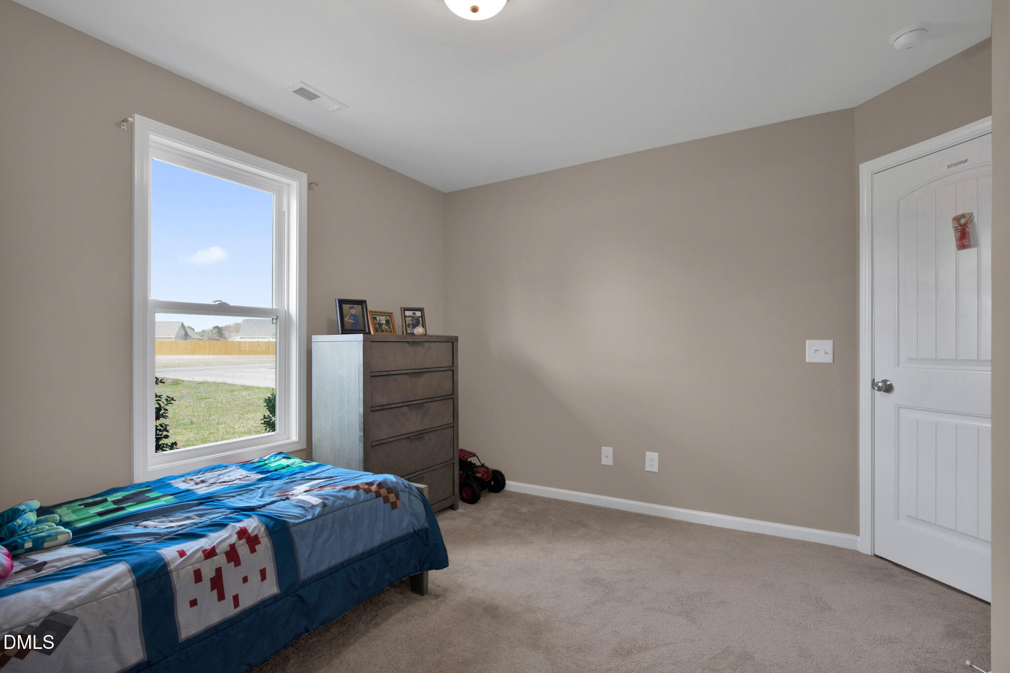 87 Hawks Croft Court Erwin, NC 28339 - Photo 23 of 30 a bedroom with a bed and a window