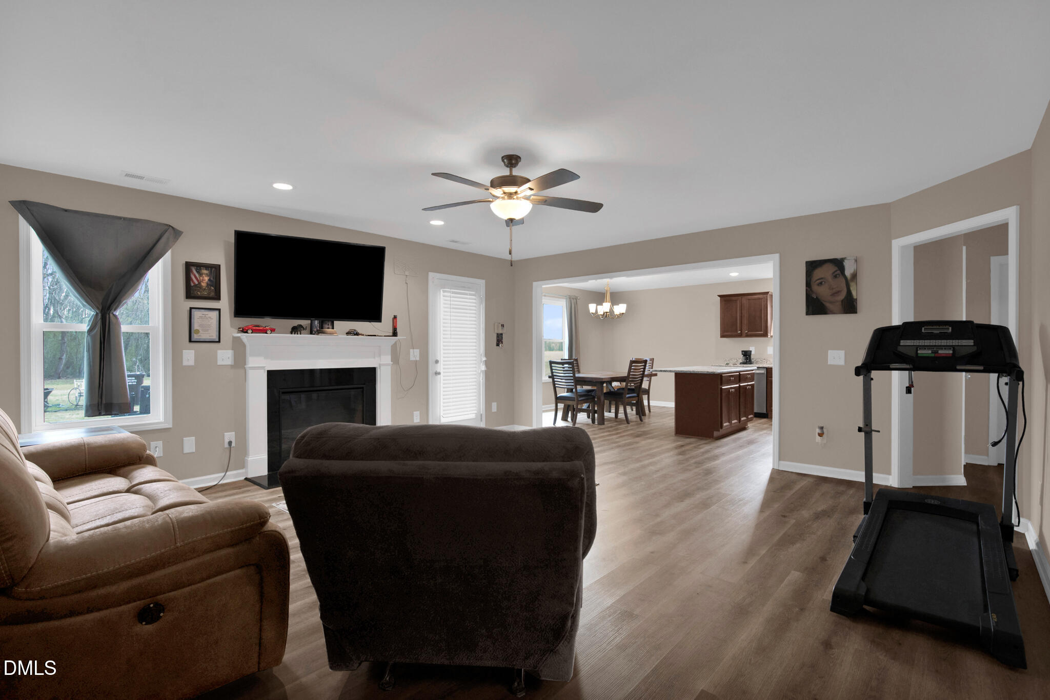 87 Hawks Croft Court Erwin, NC 28339 - Photo 9 of 30 a living room with furniture a fireplace and a flat screen tv
